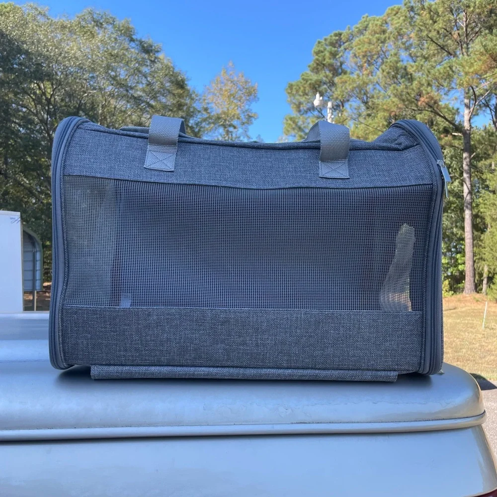 A pet travel carrier and roller. 2 doors on each side. Detachable roller base.